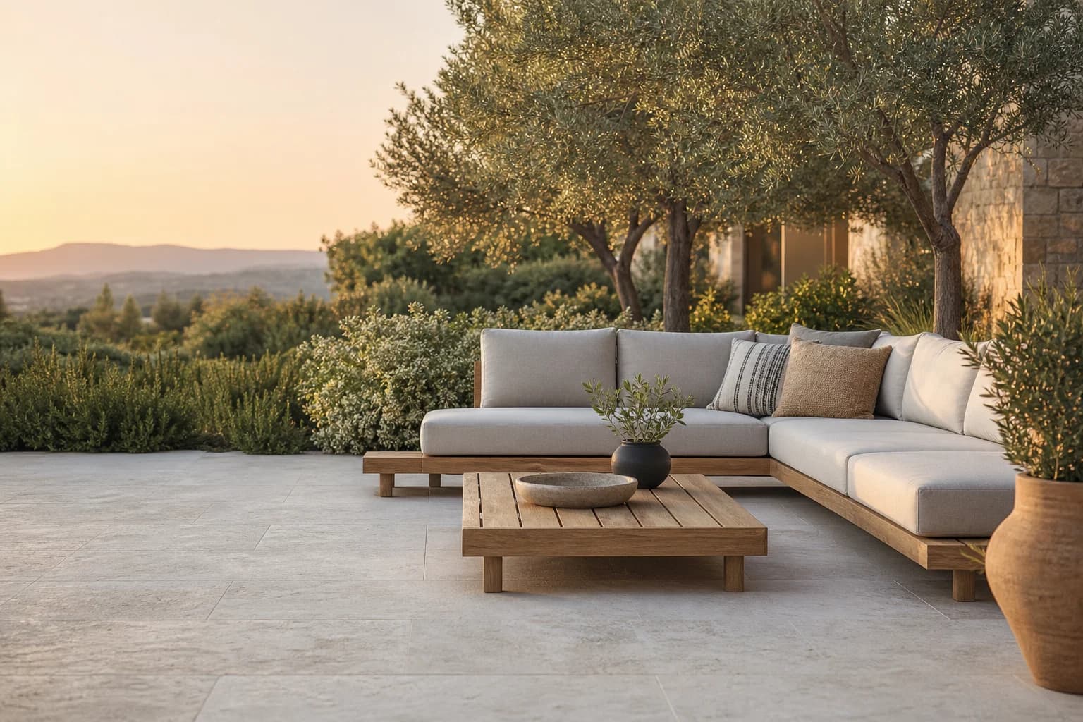 A garden patio furnished with a modern outdoor lounge set